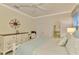 Main bedroom with dresser and ensuite bathroom access at 9895 Wingood Dr, Venice, FL 34292