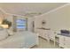 Bedroom with a desk and water view from window at 9895 Wingood Dr, Venice, FL 34292