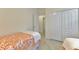 Bedroom with twin beds, closet, and access to hallway at 9895 Wingood Dr, Venice, FL 34292