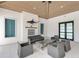 Community room with fireplace and comfortable seating at 9895 Wingood Dr, Venice, FL 34292