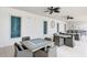 Community room with tables, chairs, and ceiling fans at 9895 Wingood Dr, Venice, FL 34292