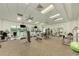 Well-equipped fitness center with cardio and weight machines at 9895 Wingood Dr, Venice, FL 34292