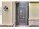 Inviting front entrance with a decorative screen door at 9895 Wingood Dr, Venice, FL 34292