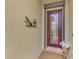 Modern front door with glass panels and a welcoming mat at 9895 Wingood Dr, Venice, FL 34292