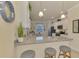 Kitchen with granite countertops and white cabinets at 9895 Wingood Dr, Venice, FL 34292