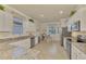 Modern kitchen with stainless steel appliances and granite counters at 9895 Wingood Dr, Venice, FL 34292
