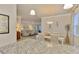 Kitchen with breakfast nook and view into living room at 9895 Wingood Dr, Venice, FL 34292
