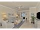 Relaxing living room with comfortable seating and access to the lanai at 9895 Wingood Dr, Venice, FL 34292
