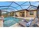 Relaxing pool area with patio and lounge chairs at 9895 Wingood Dr, Venice, FL 34292