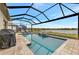 Inviting pool with screened enclosure and lake view at 9895 Wingood Dr, Venice, FL 34292
