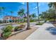 Scenic street view with shops and palm trees at 9895 Wingood Dr, Venice, FL 34292