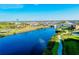 Aerial view of canal, bridge, and community at 107 Corte Del Rosa, Venice, FL 34285