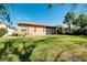 Large backyard with screened patio, providing ample outdoor space at 107 Corte Del Rosa, Venice, FL 34285