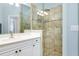 Bathroom with vanity and walk-in shower at 107 Corte Del Rosa, Venice, FL 34285