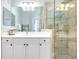 Bathroom with a vanity and large shower at 107 Corte Del Rosa, Venice, FL 34285