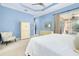 Bedroom with king-size bed, chair, and large closet at 107 Corte Del Rosa, Venice, FL 34285