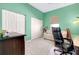 Bright bedroom with a couch, desk and double closets at 107 Corte Del Rosa, Venice, FL 34285