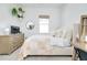 Bright bedroom with a comfortable bed and plenty of natural light at 107 Corte Del Rosa, Venice, FL 34285