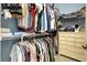 Walk-in closet with dresser and ample hanging space at 107 Corte Del Rosa, Venice, FL 34285