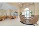 Relaxing community room with seating area and kitchenette at 107 Corte Del Rosa, Venice, FL 34285
