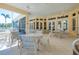 Community room with tables and chairs for residents at 107 Corte Del Rosa, Venice, FL 34285