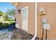 Exterior view of the home, showcasing a side entrance at 107 Corte Del Rosa, Venice, FL 34285