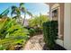 Brick walkway leading to a charming front door at 107 Corte Del Rosa, Venice, FL 34285