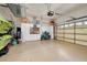 Two-car garage with storage cabinets and space for bikes at 107 Corte Del Rosa, Venice, FL 34285