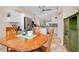Kitchen features stainless steel appliances and an island at 107 Corte Del Rosa, Venice, FL 34285