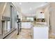 Modern kitchen with stainless steel appliances and granite counters at 107 Corte Del Rosa, Venice, FL 34285