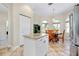 Kitchen features granite counters, island, and breakfast nook at 107 Corte Del Rosa, Venice, FL 34285