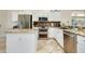 Spacious kitchen with granite countertops and stainless steel appliances at 107 Corte Del Rosa, Venice, FL 34285