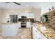 Spacious kitchen with granite countertops and stainless steel appliances at 107 Corte Del Rosa, Venice, FL 34285