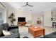 Spacious living room with a view of the kitchen and access to the backyard at 107 Corte Del Rosa, Venice, FL 34285