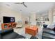 Spacious living room with a view of the kitchen and access to the backyard at 107 Corte Del Rosa, Venice, FL 34285
