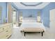 Bright main bedroom with sliding doors to the patio at 107 Corte Del Rosa, Venice, FL 34285