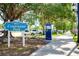 Entrance to Centennial Park with signage and pathway at 107 Corte Del Rosa, Venice, FL 34285