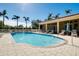 Relaxing community pool with plenty of lounge chairs at 107 Corte Del Rosa, Venice, FL 34285