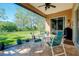 Relaxing screened porch with patio furniture and lush backyard views at 107 Corte Del Rosa, Venice, FL 34285