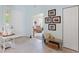 Bright entryway with light-blue walls, tiled floor, and a view of a sunroom at 11053 Barnsley Dr, Venice, FL 34293