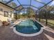 Enjoy the screened-in pool and spa from the comfort of your patio at 111 Corte Del Asolo, Venice, FL 34285