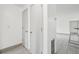 Hallway with two light gray doors and tile floor at 1114 Myrtle Ave, Venice, FL 34285