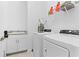 Laundry room with washer, dryer, and utility sink at 11165 Balfour St, Venice, FL 34293