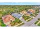 Aerial perspective of a residential street with houses and landscaping at 12386 Sagewood Dr, Venice, FL 34293