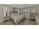 Spacious bedroom with a king-size bed and plenty of natural light at 12386 Sagewood Dr, Venice, FL 34293