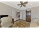 Spacious home office with built-in shelving and hardwood floors at 12386 Sagewood Dr, Venice, FL 34293
