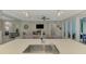 Open concept kitchen with island and stainless steel appliances at 12386 Sagewood Dr, Venice, FL 34293