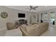 Spacious living room with comfortable seating and access to pool at 12386 Sagewood Dr, Venice, FL 34293