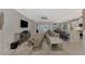 Relaxing living room with comfortable seating and access to backyard at 12386 Sagewood Dr, Venice, FL 34293