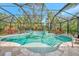 Enclosed pool and spa with plenty of space for relaxation at 12386 Sagewood Dr, Venice, FL 34293